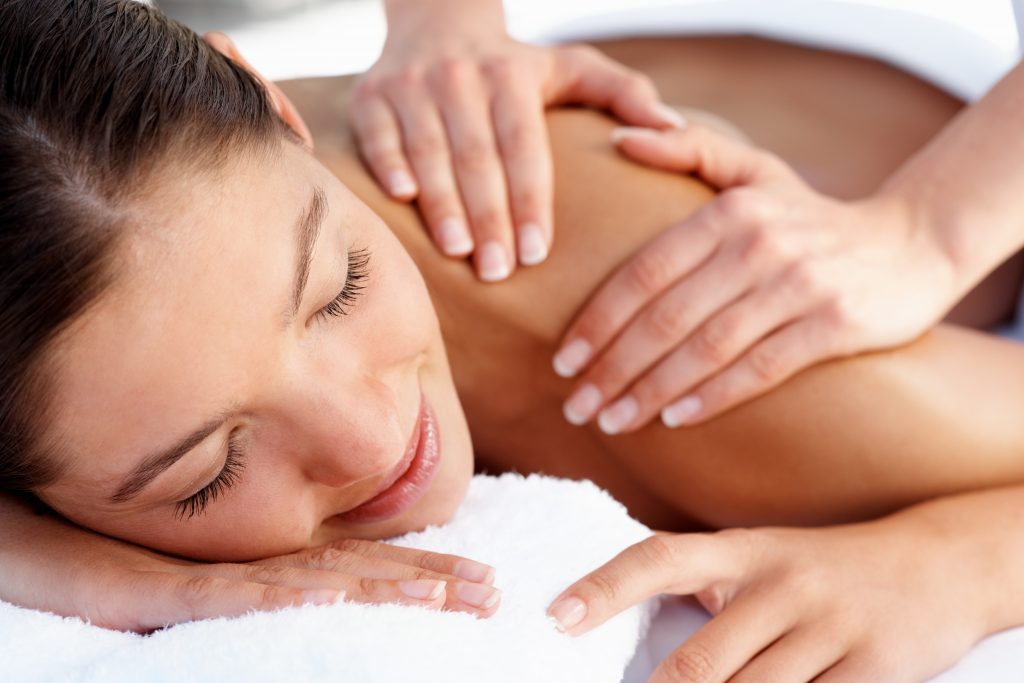 Client receiving a relaxing professional back massage